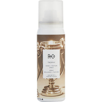 Bottle of TROPHY Styling Spray, a lightweight texture and shine spray for all hair types, in a sleek 198ml container