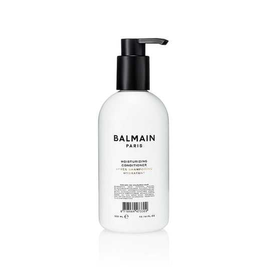 <img src="balmain-moisturizing-conditioner.jpg" alt="Balmain Moisturizing Conditioner bottle with sleek packaging designed for smooth, hydrated hair" />
