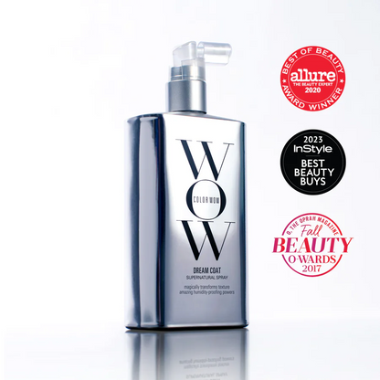Bottle of Color Wow Dream Coat Supernatural Spray, a humidity-proof, anti-frizz hair treatment with a sleek silver design and black cap