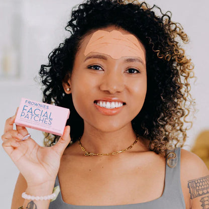Woman using frownies forehead wrinkle patches