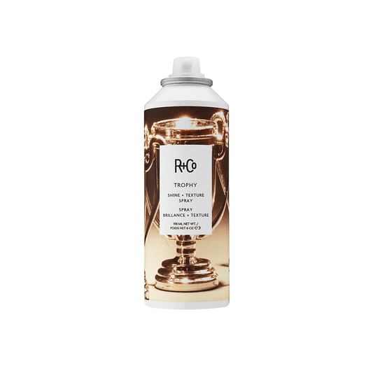<img src="path/to/trophy-styling-spray-bottle.jpg" alt="TROPHY styling spray bottle">
<img src="path/to/model-using-trophy-spray.jpg" alt="Model using TROPHY styling spray on hair">
<img src="path/to/close-up-hair-styled-with-trophy-spray.jpg" alt="Close-up of hair styled with TROPHY spray">