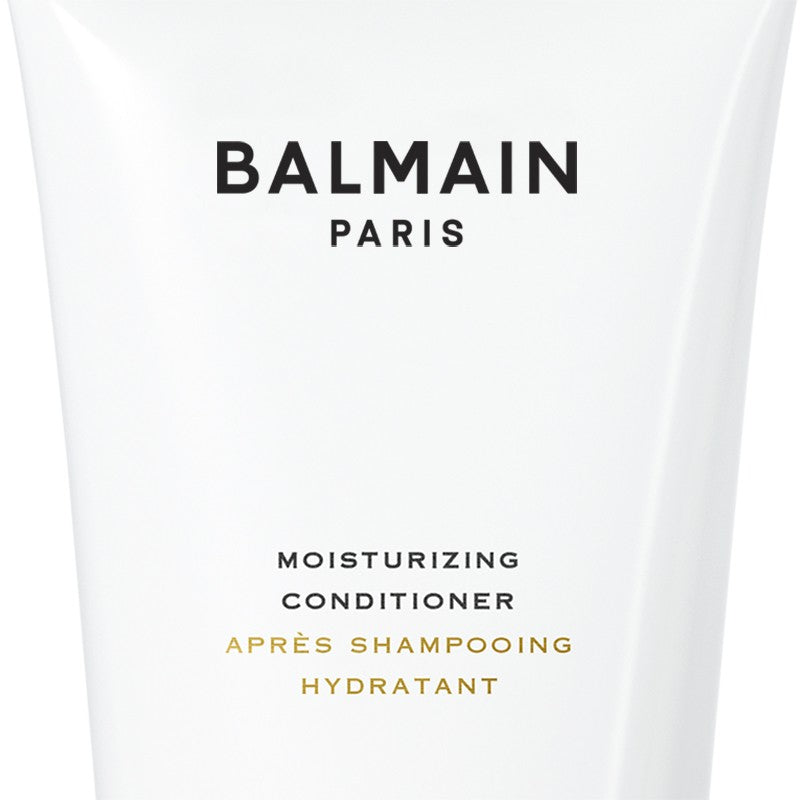 Close up of the label of Travel Size Balmain Moisturizing Conditioner.