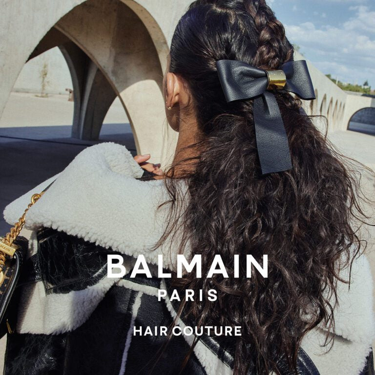 Balmain Hair Couture | Leather Barrette Bow with 18K Gold Detail fashion magazine ad